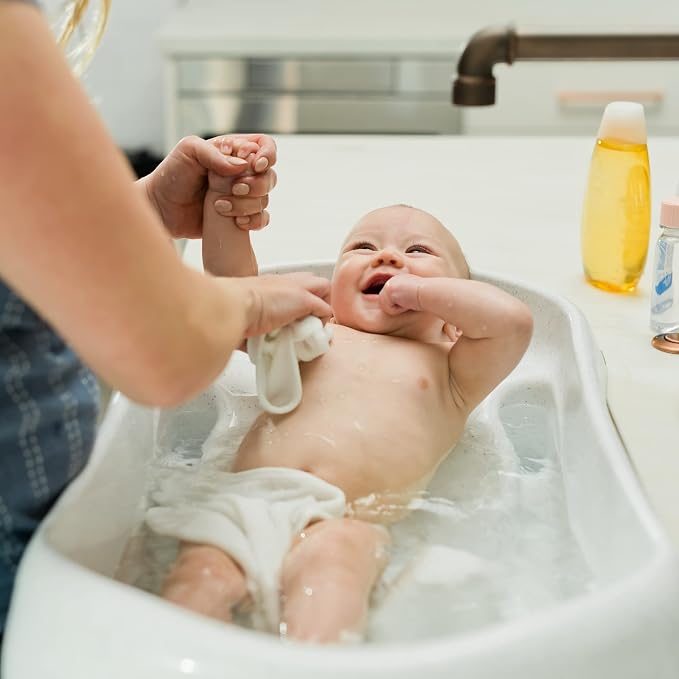 The First Years First Suds Newborn to Toddler Tub – 3 Stage Baby Bathtub with Soft, Non-Slip Infant Sling – Birth to 25 Pounds